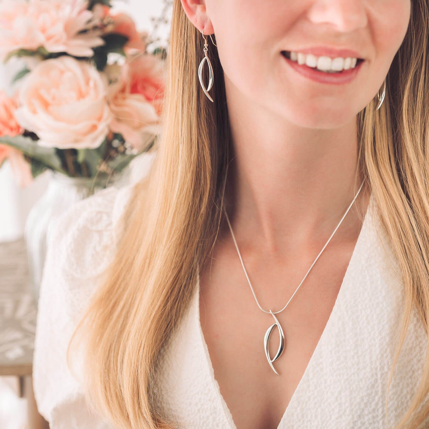 matching pendant and earrings on woman