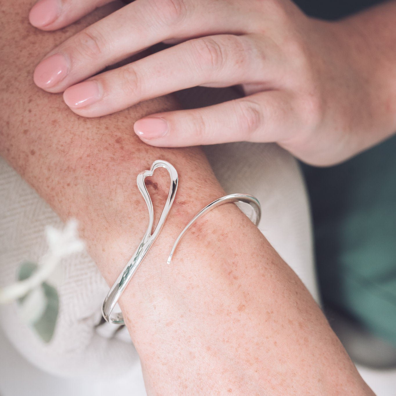 Sterling Silver Zoe Shaped Heart Bangle With a Sweeping Tail Across The Front Of The Bangle