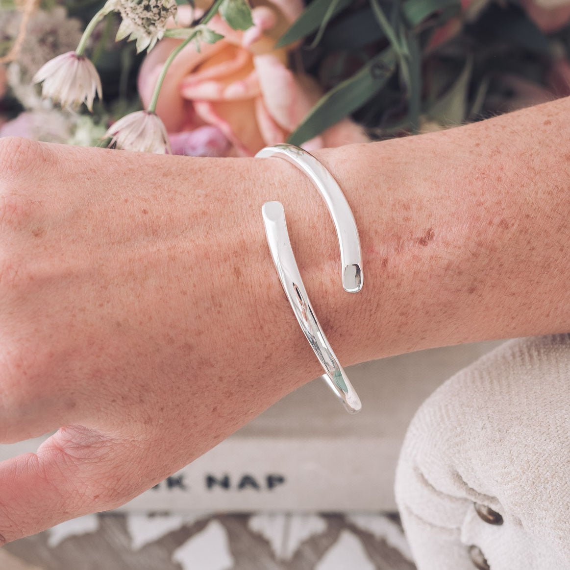 Handmade Silver bangle with crossover detail