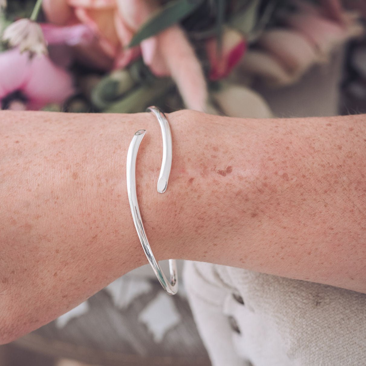 Handmade Silver bangle with crossover detail