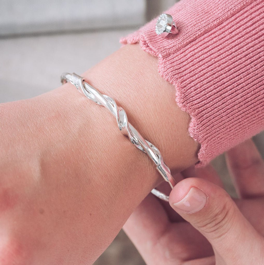 Handmade Silver Textured Bangle With Twisted Ribbon Detail