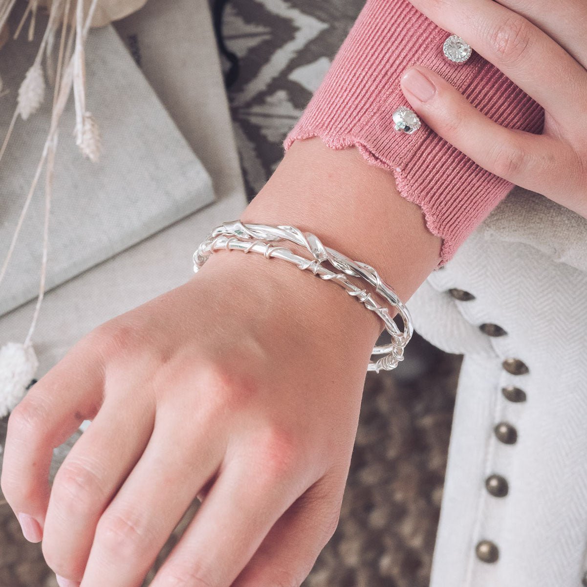 Handmade Silver Textured Bangle With Twisted Ribbon Detail