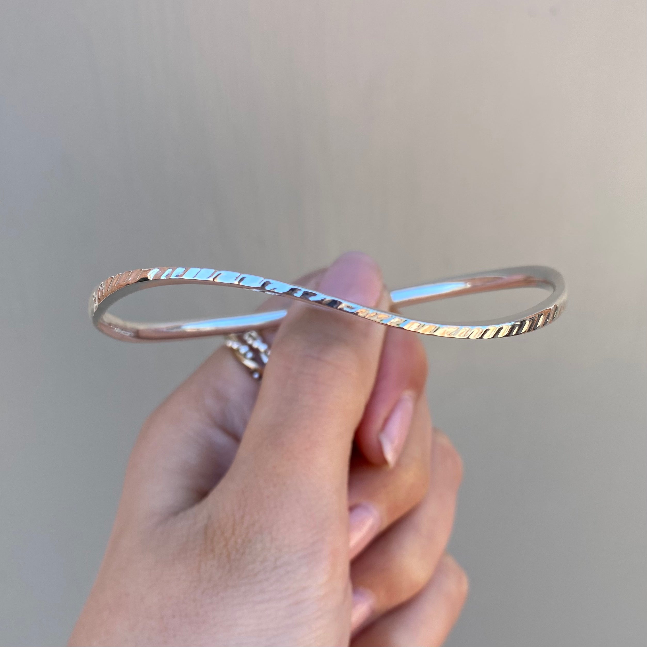 Handmade Textured Silver Bangle With a Subtle Wave