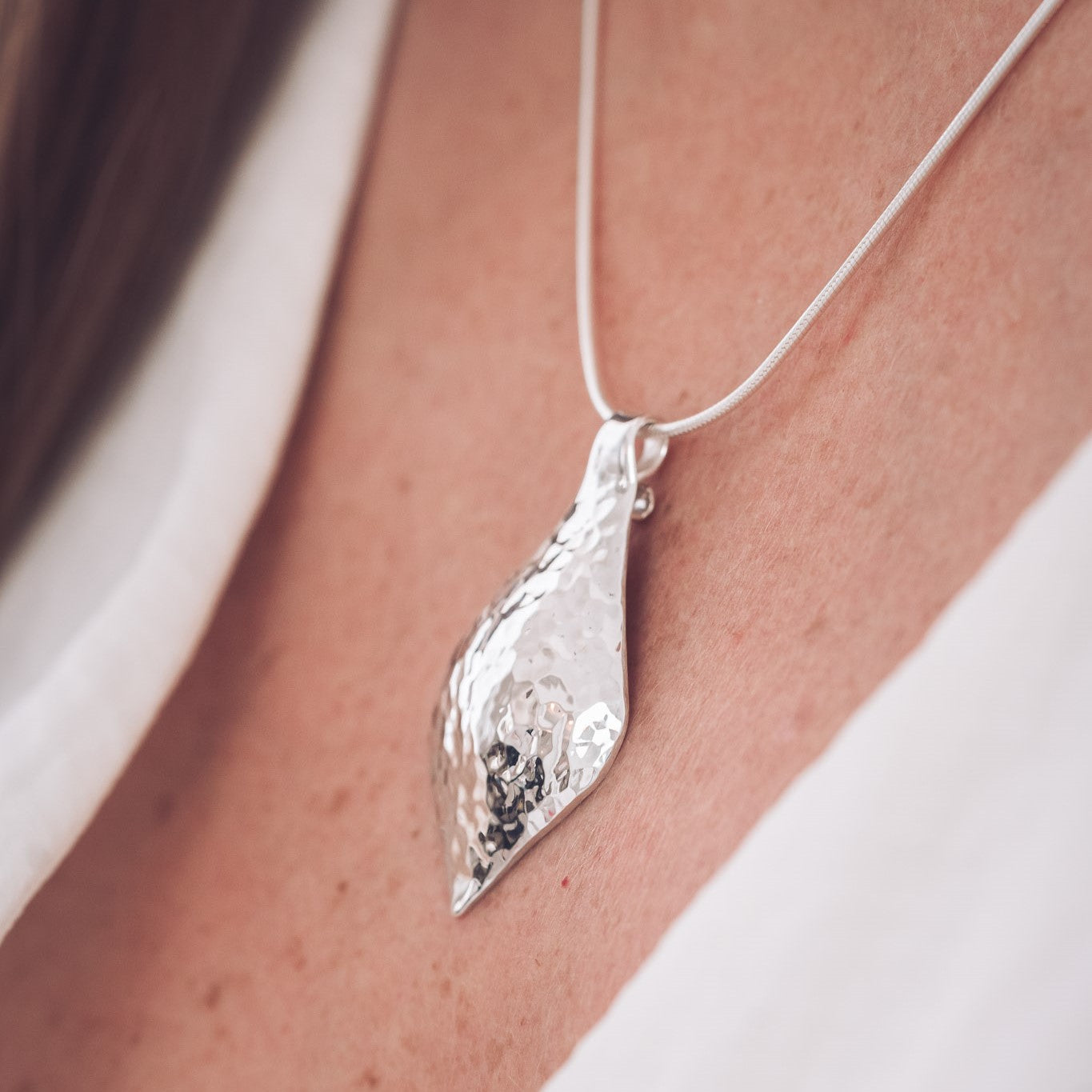 Handmade hammered teardrop silver pendant