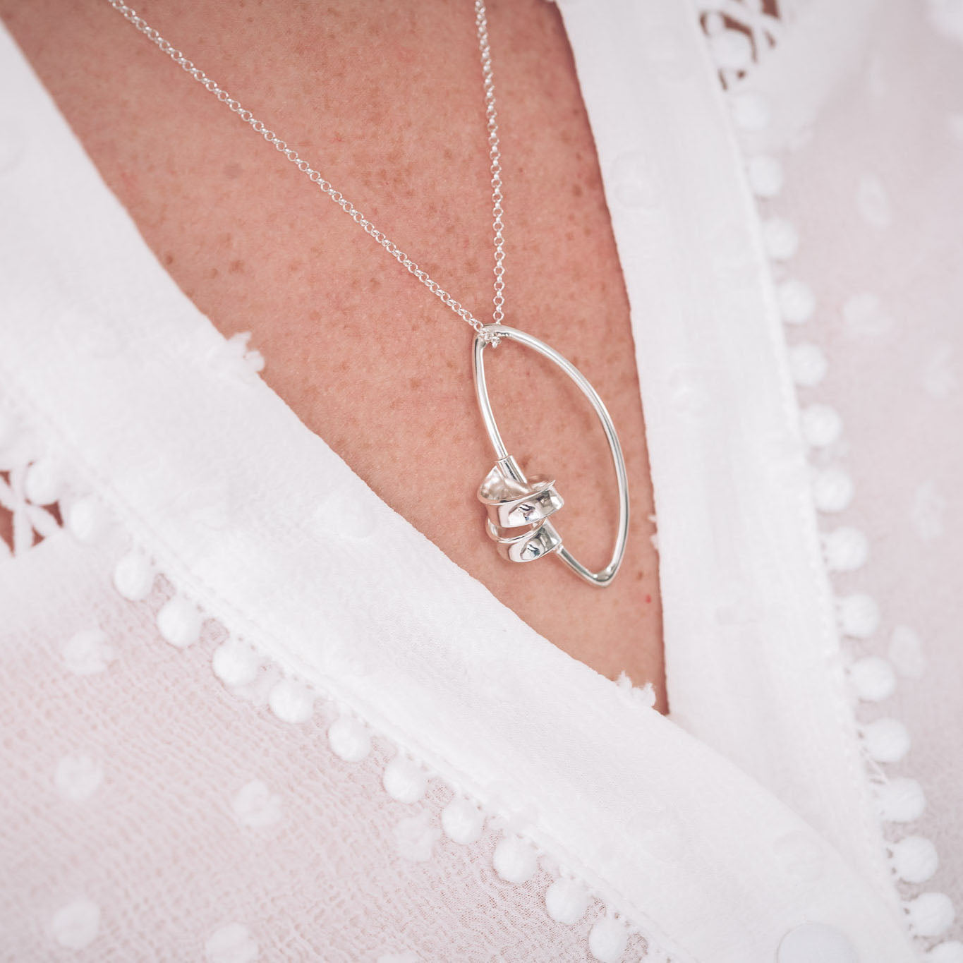 Handmade Sterling Silver Ribbon Necklace on our Marquise Frame