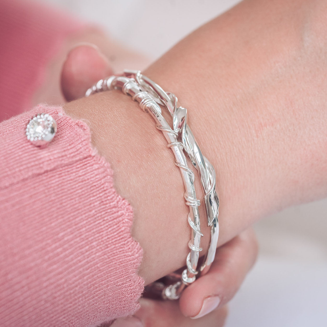 Handmade Silver Textured Bangle With Twisted Ribbon Detail