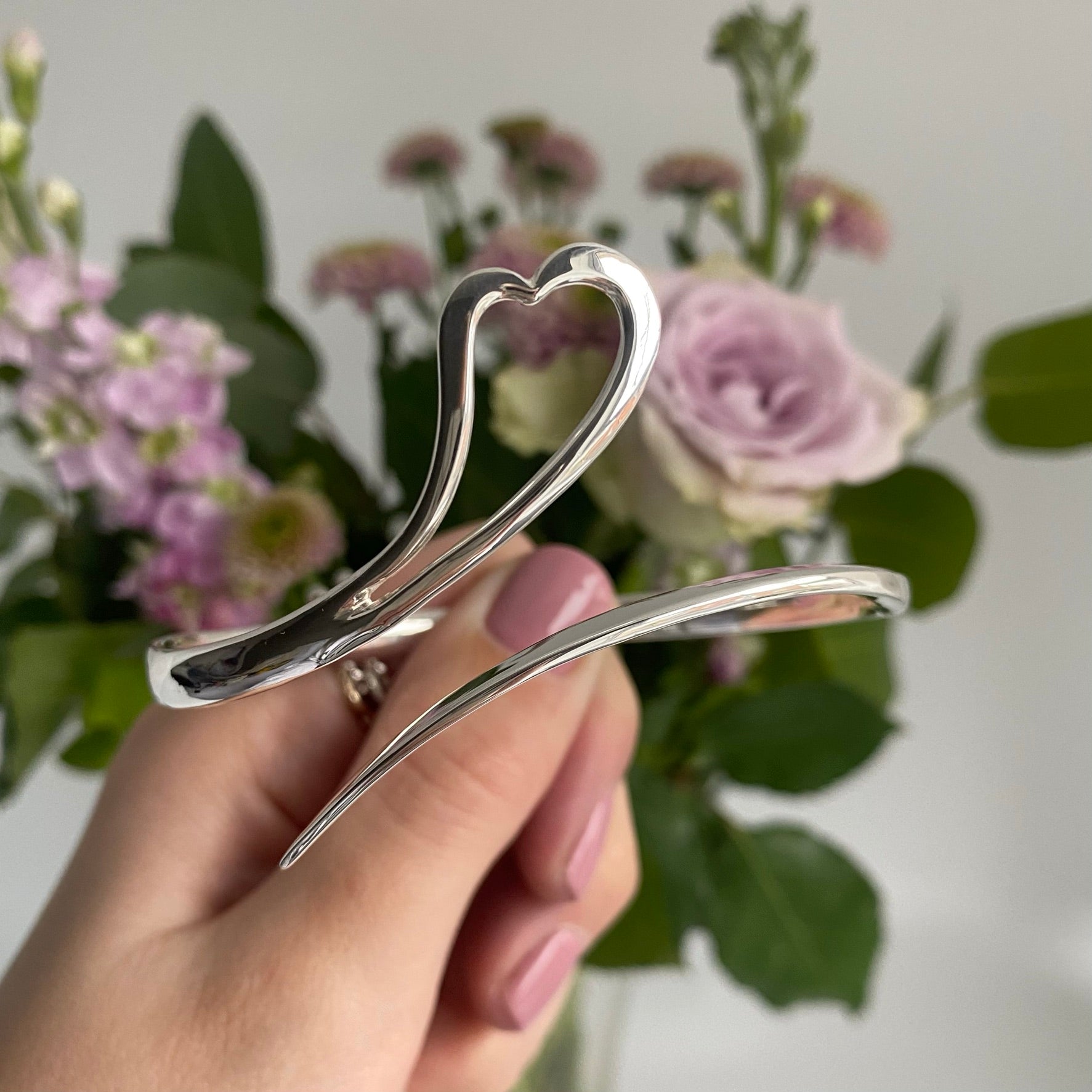 Sterling Silver Zoe Shaped Heart Bangle With a Sweeping Tail Across The Front Of The Bangle